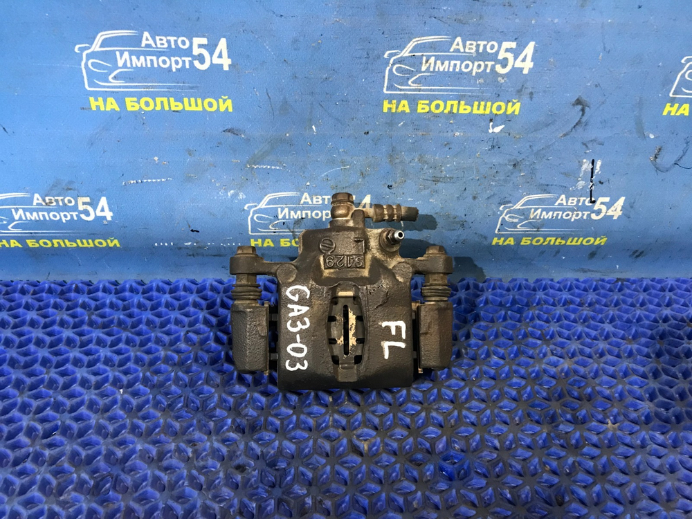 Суппорт тормозной передний левый Honda LOGO 2000