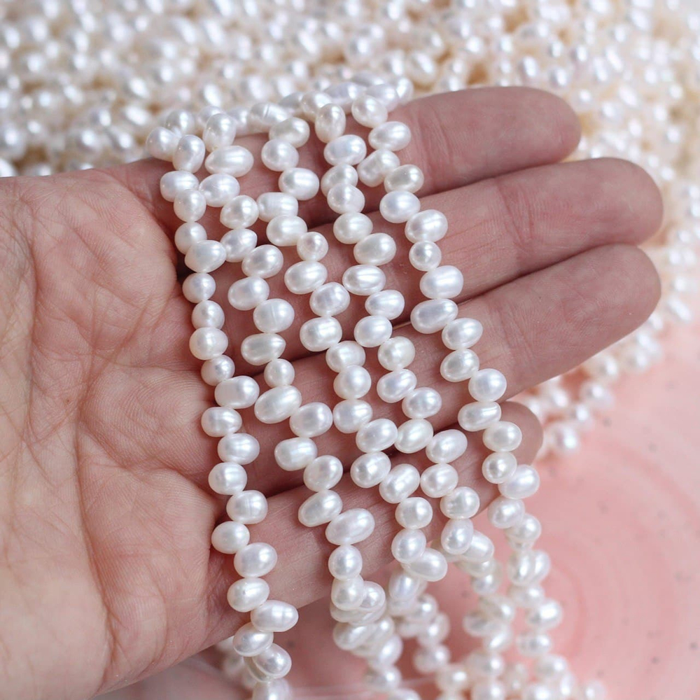 Ж013 Жемчуг натуральный "Рис" 7*5мм, нить 36см