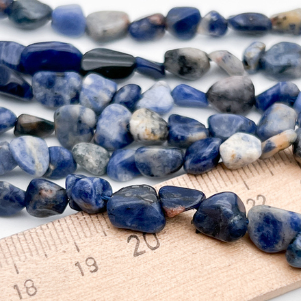 Содалит бусины, галтовка, размер около 6-9 мм, цена за нить 38 см