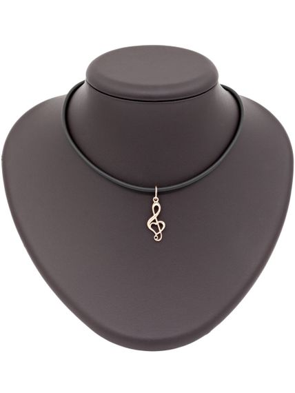 Фото кулона Скрипичный ключ из золота, вид на постаменте.