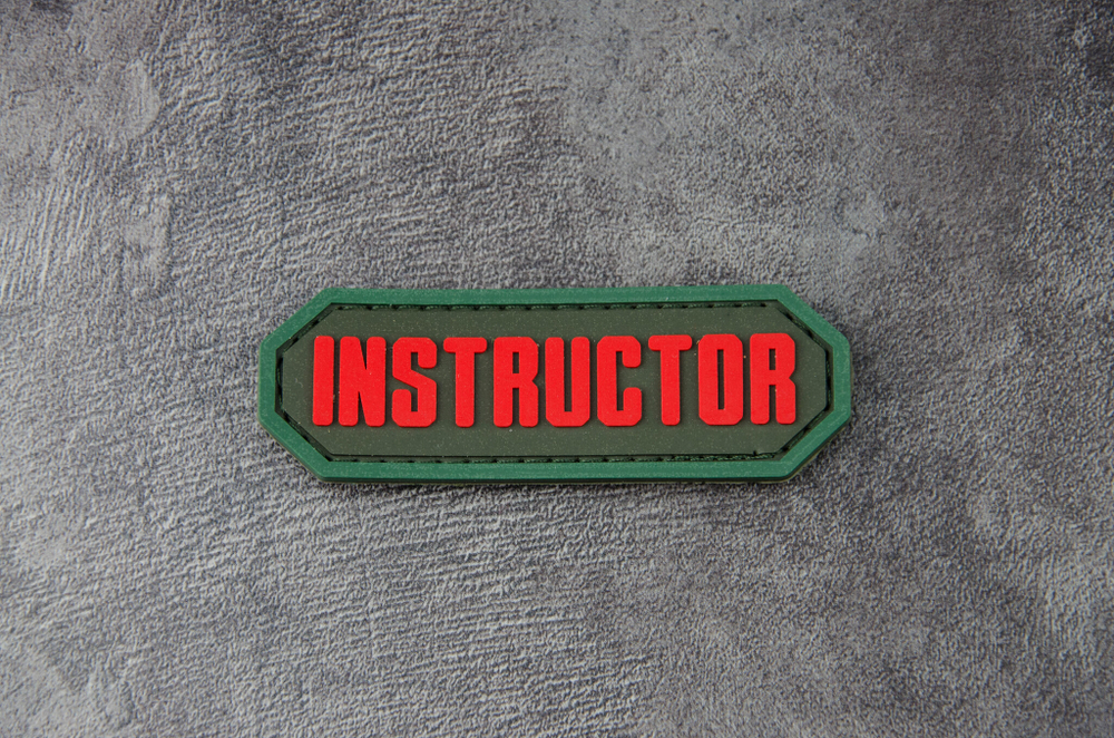 Шеврон Instructor PVC. Красный на оливе