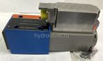 4WRPEH10C5B100L-2X/G24K0/F1M - Сервораспределитель Ду10 с обратной связью по положению золотника и встроенным усилителем (OBE), номинальный расход 100 л/мин, характеристика L - линейная, схема C5, сигнал управления F1 = 4...20 mA