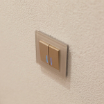 Выключатель двухклавишный проходной с подсветкой (шампань рифленый)