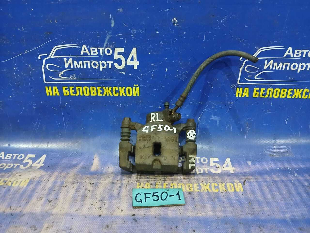 Суппорт тормозной задний левый NISSAN CIMA 2002
