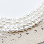 Жемчуг, размер около 5,5*4,5 мм, цена за 31-32 шт (1/2 нити)