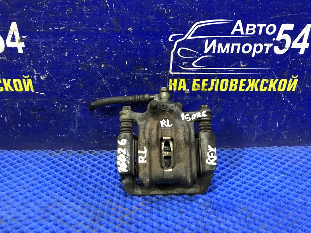 Суппорт тормозной задний левый Honda STEPWGN 1996-2001