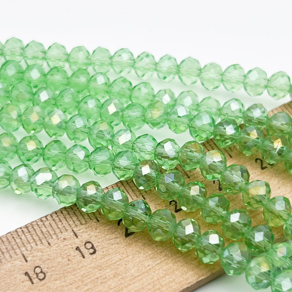 Бусины рондель с огранкой, стекло, цвет салатовый, размер около 4,8*6 мм, цена за 38-39 шт (1/2 нити)