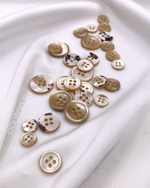 Пуговицы перламутровые с персиковым отливом на прокол