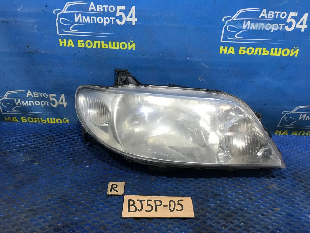 Фара передняя правая MAZDA FAMILIA 2000