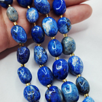 Лазурит с включениями пирита, крупная галтовка, 12-15 мм, камни овалы, цена за нить 12.5 - 13 см (1/3 нити)
