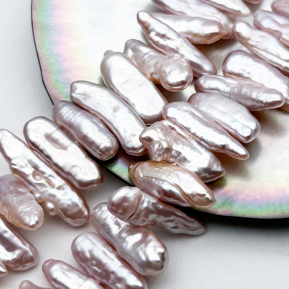 Жемчуг бусины, цвет розовый, размер около 4,5-6,5*14-19 мм, цена за 15-16 шт (1/4 нити)