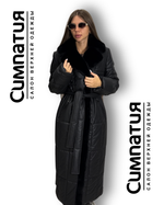 Стильное пальто в черном цвете с декоративными деталями