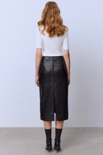 Юбка из лакового твида