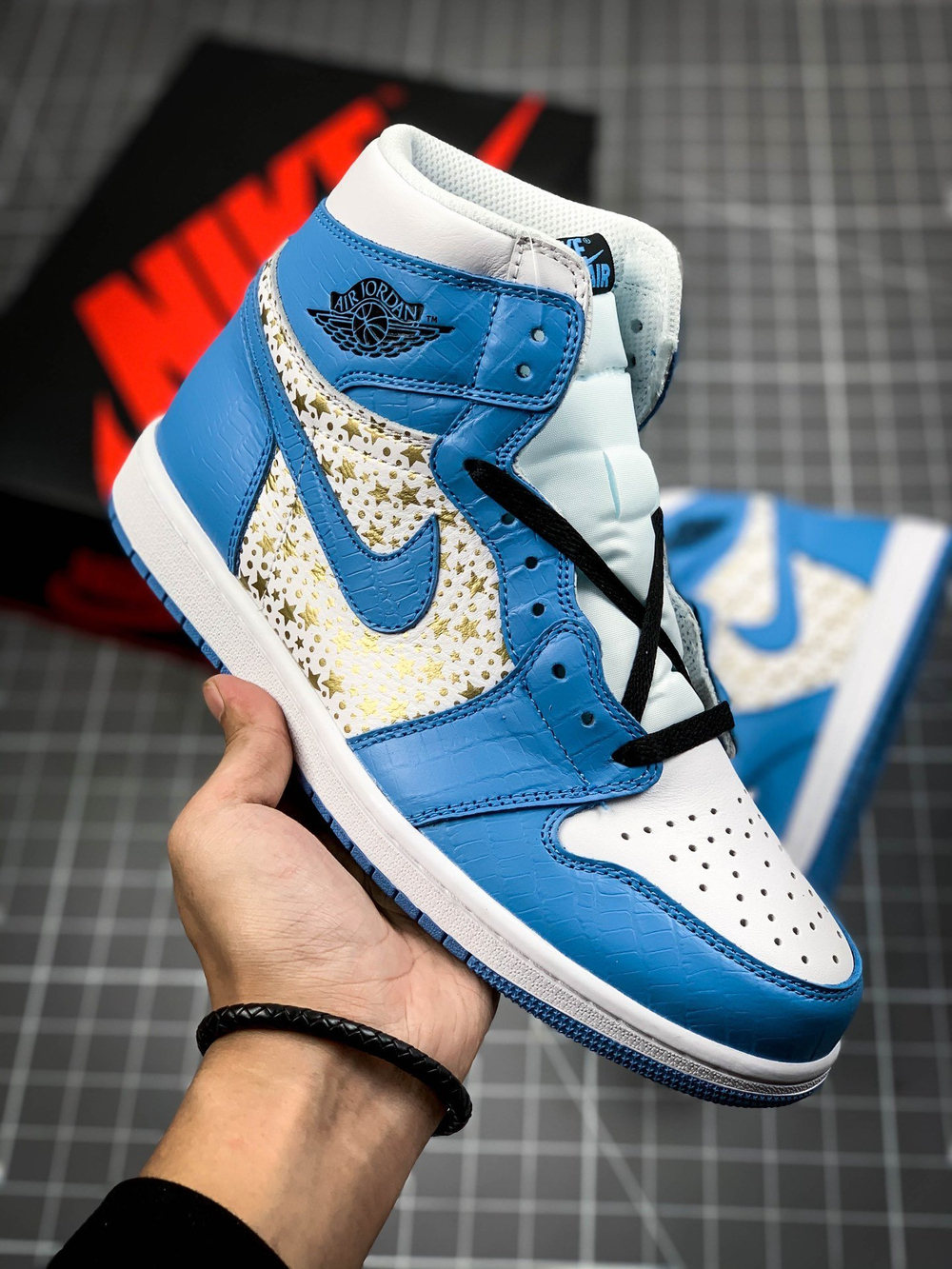 AIR JORDAN RETRO 1 HIGH OG X SUPREME WHITE/BLUE/GOLD-BLACK