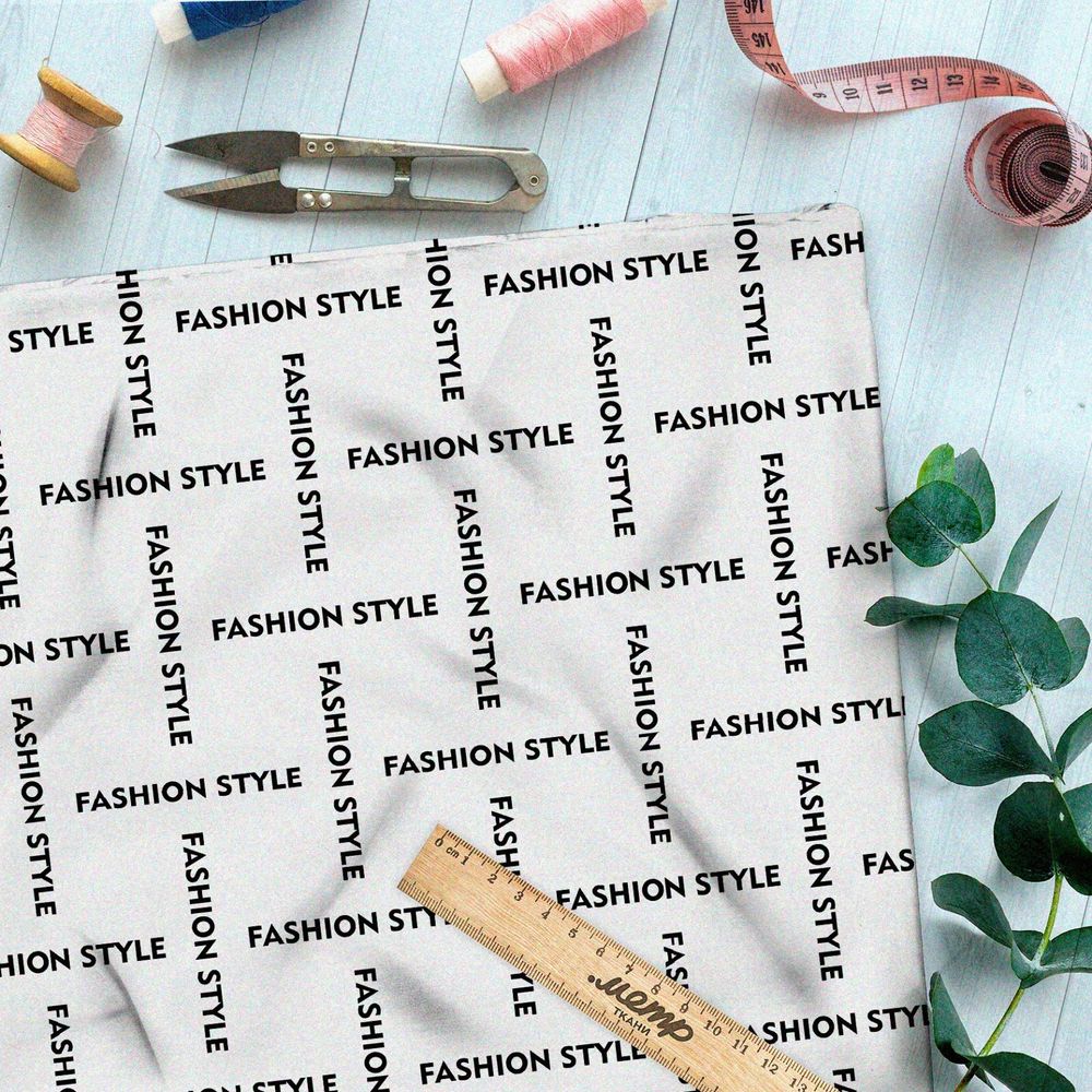 Ткань штапель стильная клетка из чёрных надписей на бежевом фоне