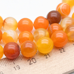 Агат тонированный бусины (сорт Б), цвет оранжевый, диаметр около 10-10,3 мм, цена за 18-19 шт (1/2 нити)