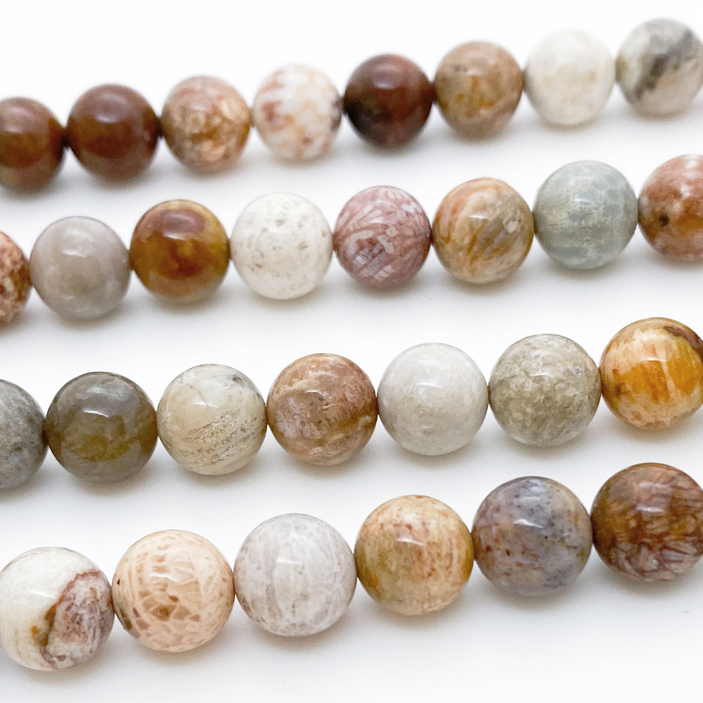 Коралл окаменелый, диаметр 8,2-8,3 мм, цена за 22-23 шт (1/2 нити)