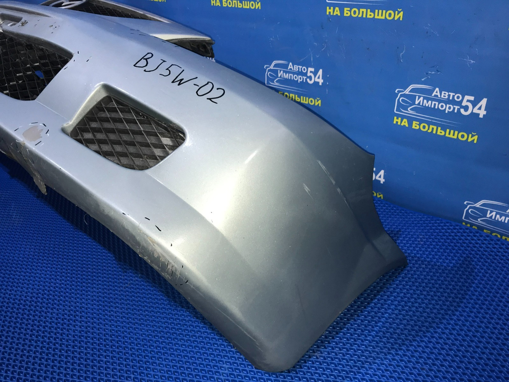Бампер передний MAZDA FAMILIA 2001
