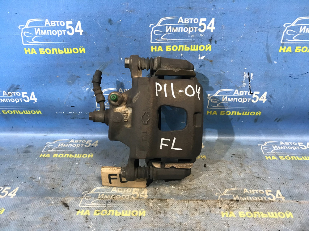 Суппорт тормозной передний левый NISSAN PRIMERA 1999