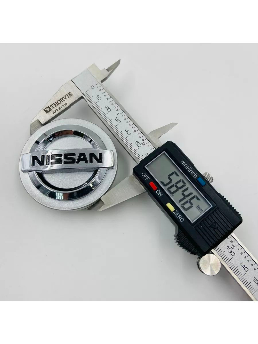 Колпачки заглушки на литые диски с эмблемой Nissan 59 мм 4 шт