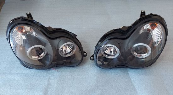 Передние фары Mercedes C W203 angel eyes black