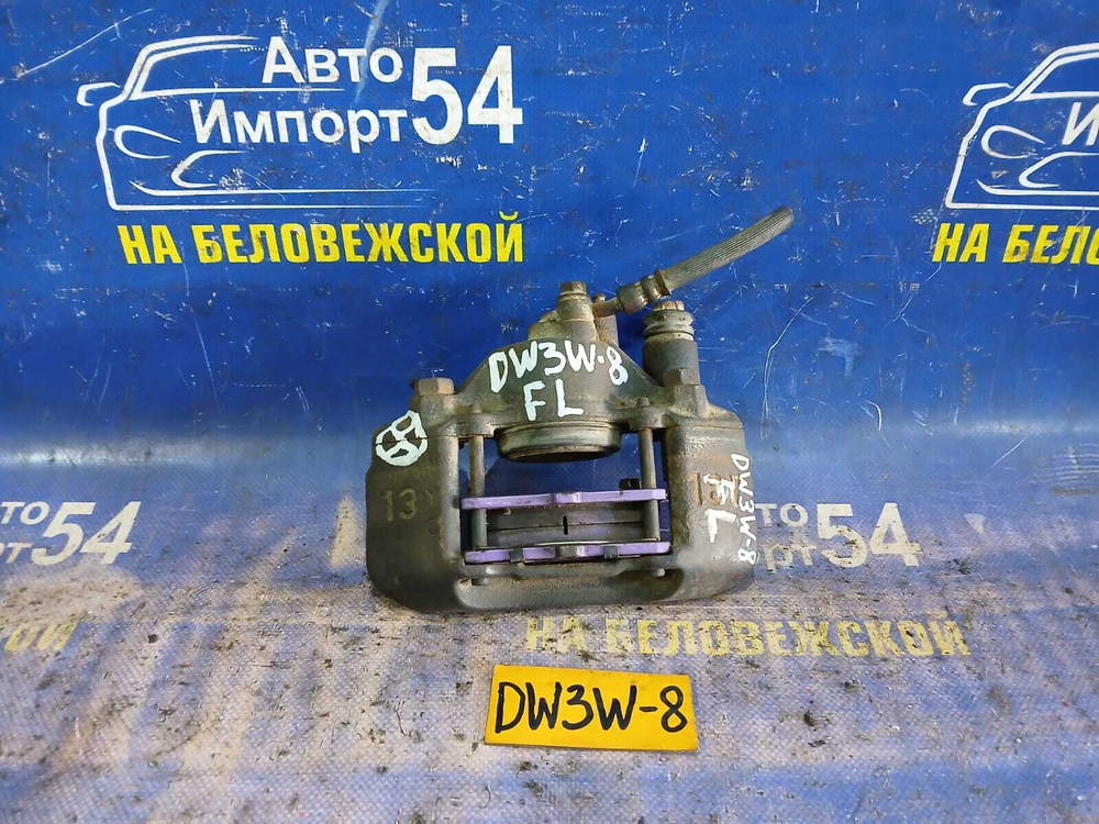 Суппорт тормозной передний левый MAZDA DEMIO 1998