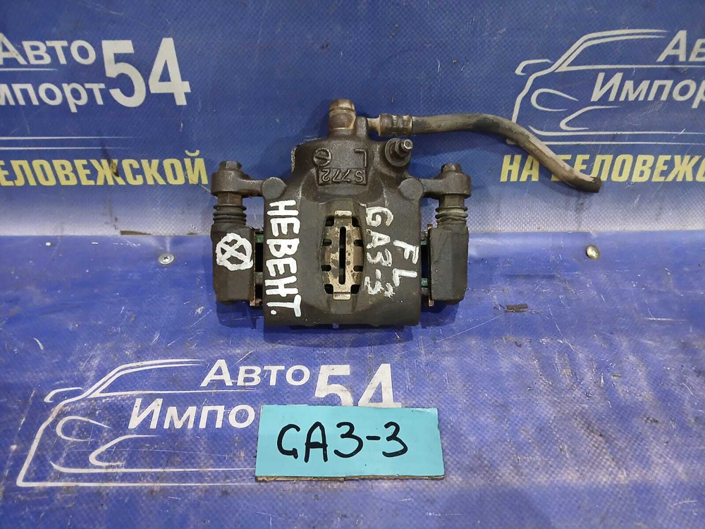 Суппорт тормозной передний левый Honda LOGO 1997
