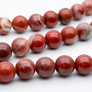Яшма красная бусины, диаметр 10,6-10,8 мм, цена за 9 шт (1/4 нити)