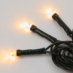 ULD-S2000-200-DGA WARM WHITE IP20 Гирлянда светодиодная. 20м. 200 светодиодов. Теплый белый свет. Провод зеленый. ТМ Uniel