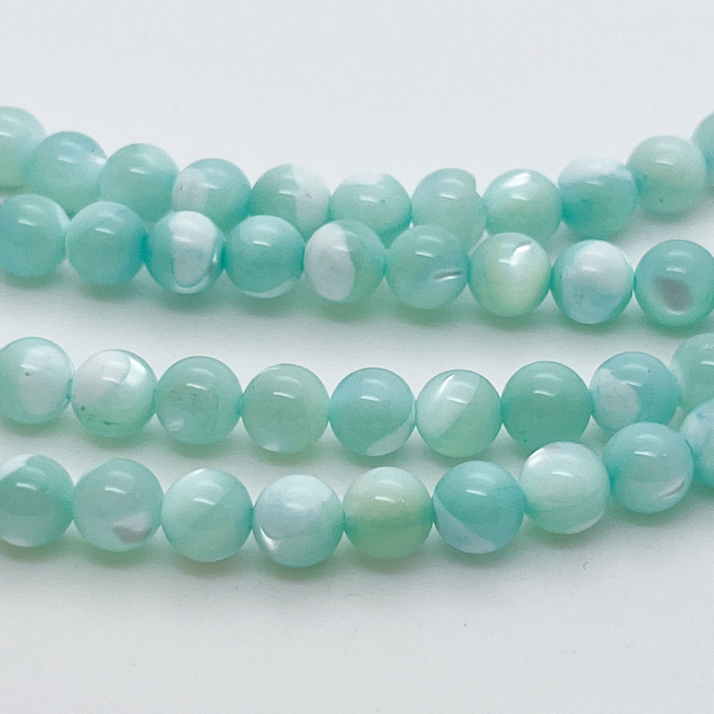 Перламутр тонированный, цвет голубой, диаметр 6,3 мм, цена за 31-32 шт (1/2 нити)