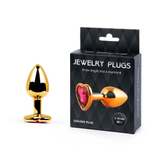 Золотистая анальная пробка с малиновым кристаллом-сердечком - 7 см. (Цвет: малиновый)