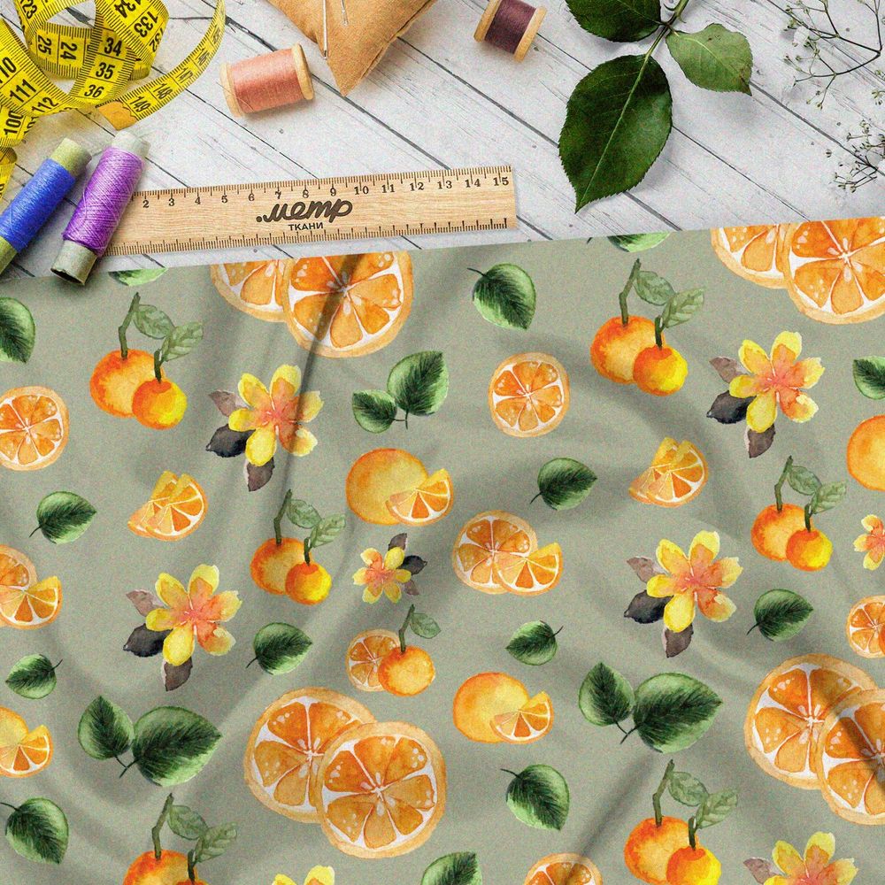Ткань кулирная гладь апельсины на зелёном фоне