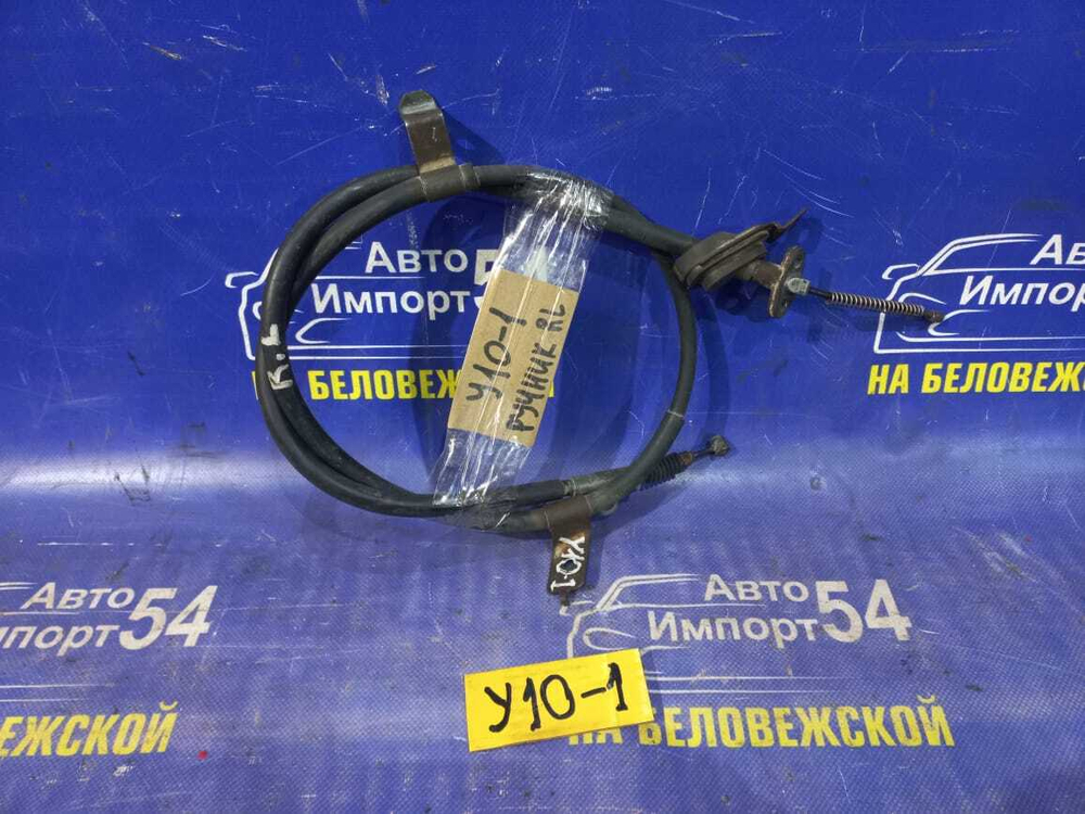 Трос ручника левый NISSAN WINGROAD 1997
