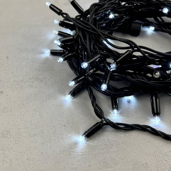 Светодиодная гирлянда с колпачком 75 холодных белых LED ламп 10 м., мерцание, 24В., черный каучуковый провод, IP65, LTC (LL75BLW-1-1W)