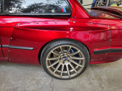 BMW E30 PANDEM (ROCKET BUNNY) Задняя левая накладка (Реплика "Стекловолокно")