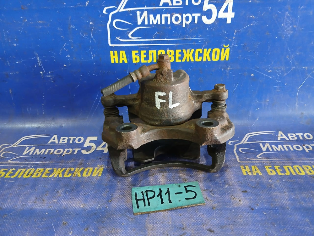 Суппорт тормозной передний левый NISSAN PRIMERA 1998