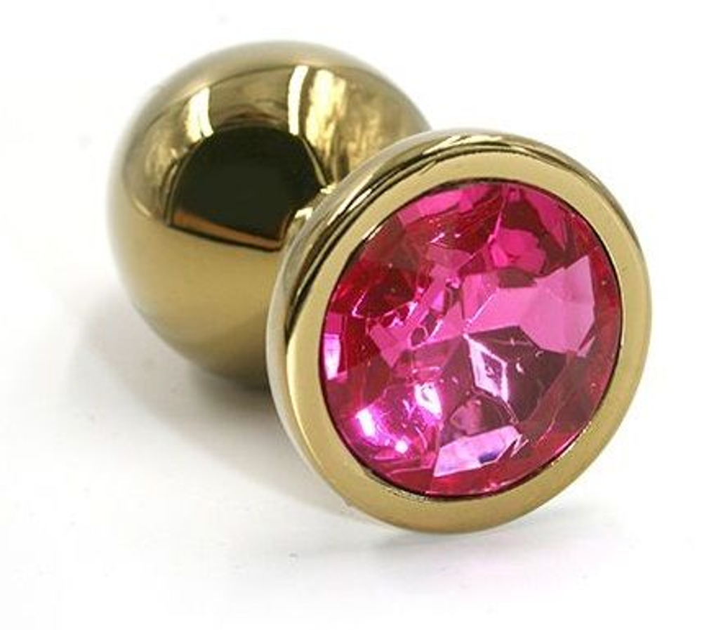 Золотистая алюминиевая анальная пробка с ярко-розовым кристаллом - 7 см. (Цвет: розовый)