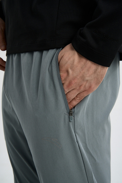 Брюки текстильные ANTA RUNNING Woven Track Pants