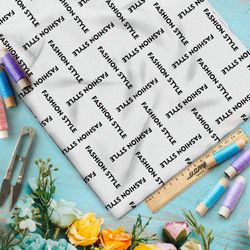 Ткань шелк Армани стильная клетка из чёрных надписей на бежевом фоне