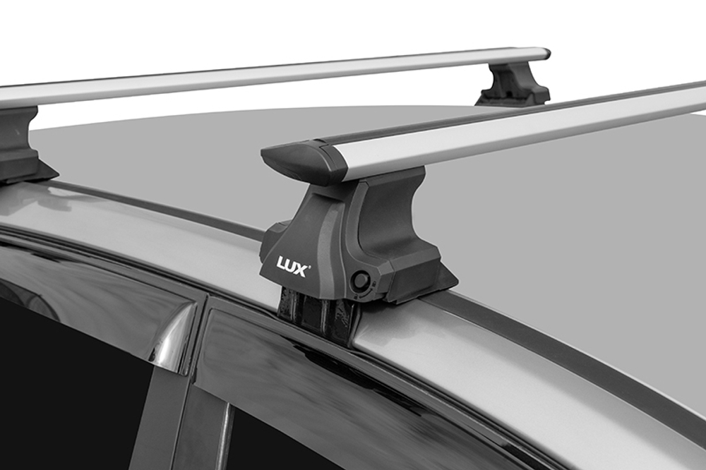 Багажник D-Lux 1 на гладкую крышу крыловидные дуги 130 см.