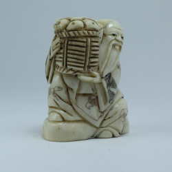 Нэцкэ Монах с корзиной рыбы