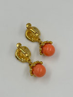 Клипсы с оранжевыми подвесками