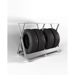 Серый металлический стеллаж для широкой резины (до 320 мм), горизонтальное хранение колес с дополнительной полкой.