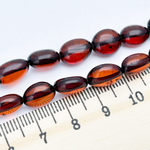 Янтарь бусины, галтовка темная, размер 10-11,6*7,1-8,4 мм, цена за 9 шт (1/4 нити)