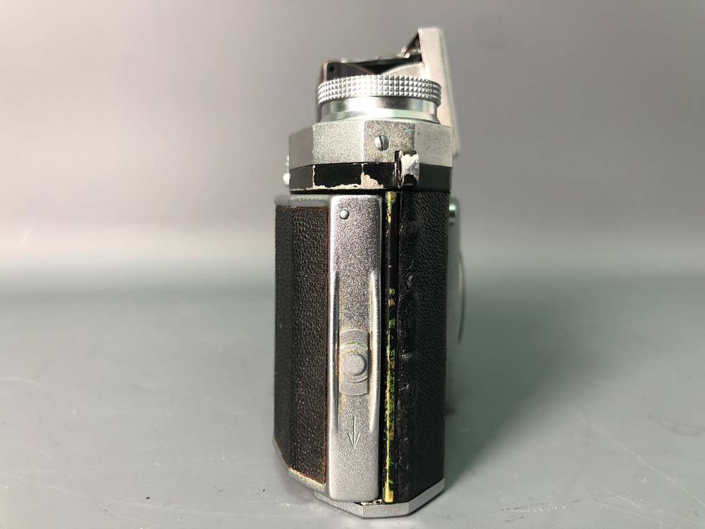 Praktica + Biometar 5,8cm 1:2, зеркало исцарапано, присутствуют пузырьки воздуха.