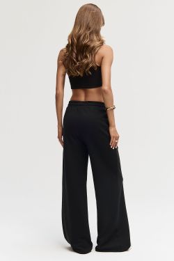 Брюки клеш со стрелкой черного цвета