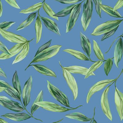 Зеленые листья на голубом фоне