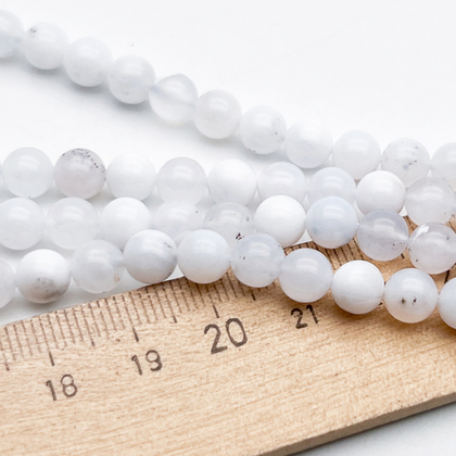 Опал белый бусины, диаметр 6,4-6,6 мм, цена за 14-15 шт (1/4 нити)
