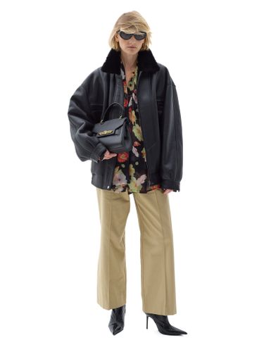 Черная кожаная оверсайз дубленка с отложным воротником