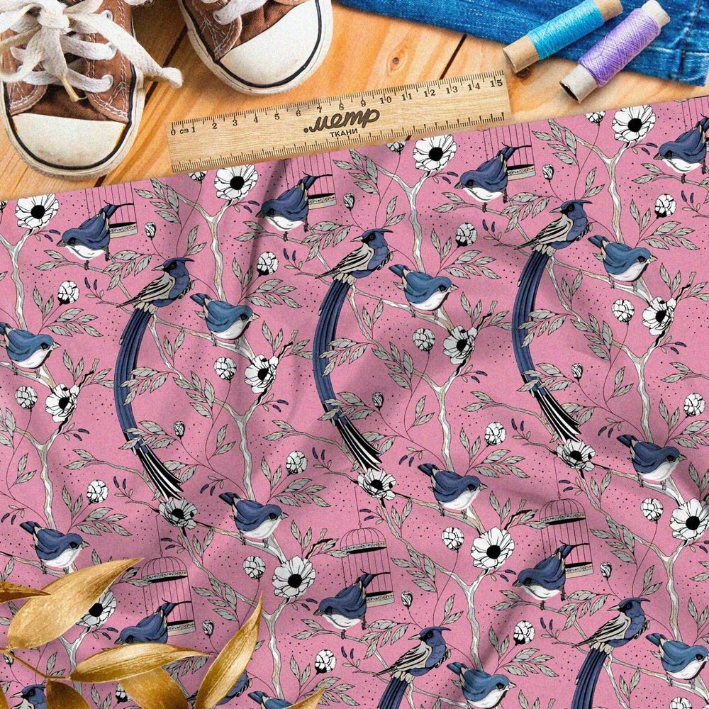 Ткань кулирная гладь мелкие снегири, цветы и птичьи клетки на розовом фоне